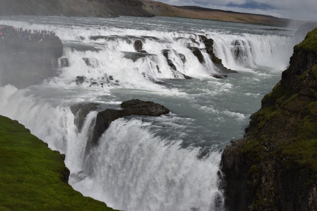 Gullfoss is a 105 ft / 32 meter tall waterfall that is 800 feet / 244 meters wide at certain points on the river. There are 2 drops to this waterfall. The upper portion is 35 feet / 10 meters and the lower portion, which is partially obscured from view, is 65 feet / 20 meters tall. 