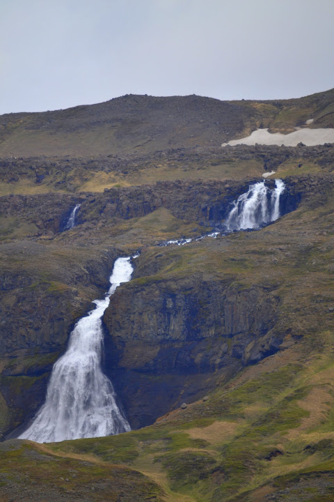 Rjúkandafoss (Fremsta-Rjúkandi) is a 393 foot / 120 meter tall waterfall in Iceland. It has multiple drops and fans out as it approaches the base.