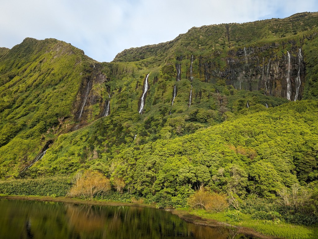 Cascata da Ribeira do Ferreiro is not just one waterfall, but many waterfalls cascading parallel to each other. The falls are 300 feet / 90 meters tall.