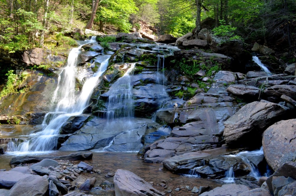 This is Bastion Falls, a waterfall in upstate New York. The waterfall is about 30 feet (10 meters) tall. It is a rather wide waterfall also, though water is mostly flowing on the left half when the visit occurred.