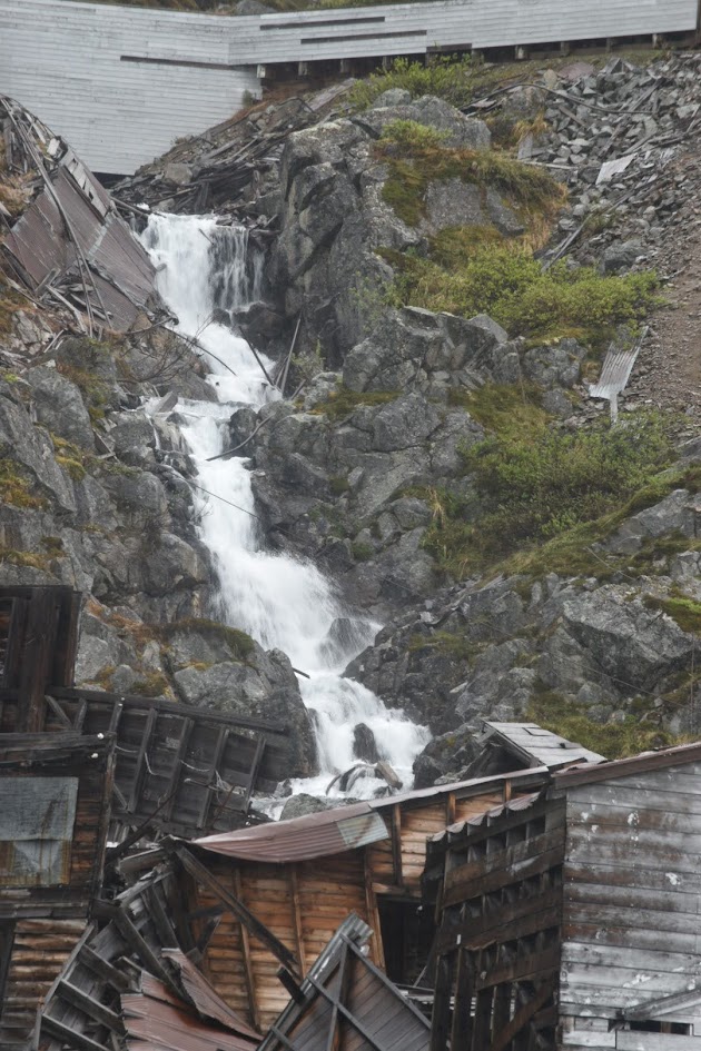This is a 40 foot / 12 meter tall waterfall in Alaska's Independence Mine Historic State Park. There are the remnants of an abandoned gold mine surrounding the waterfall. 