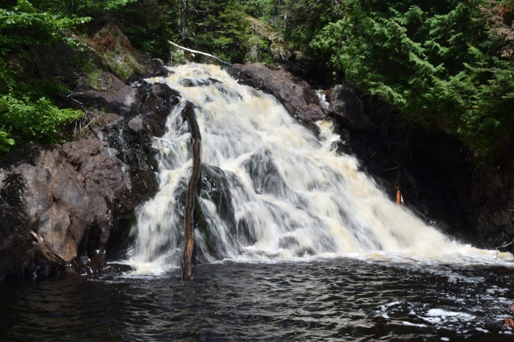 This is Pinnacle Falls, a 20 foot / 6 meter tall waterfall in Michigan's Upper Peninsula. The falls widen out near the base.