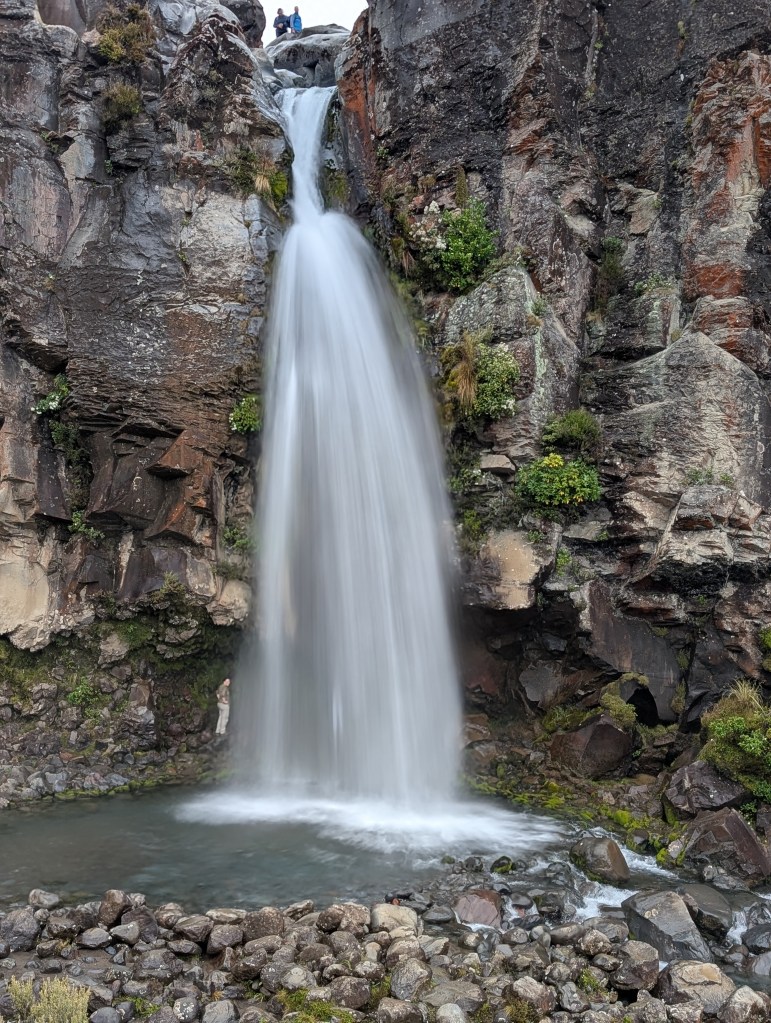 Taranaki Falls is a 66 foot / 20 meter tall waterfall found in Tongariro National Park on New Zealand's North Island. It is surrounded by beautiful rock walls.