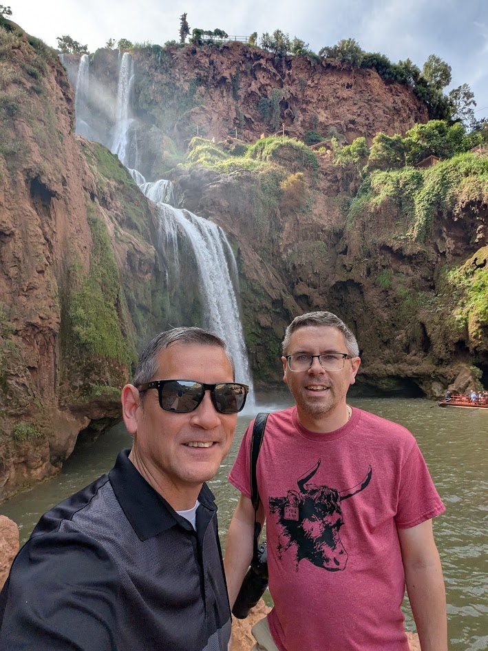 These are two men at a waterfall in Morocco.