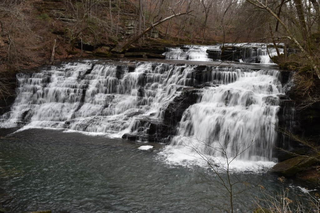 Rutledge Falls is a 30 foot / 9 meter tall waterfall that is at least as wide as it is tall. The waterfall cascades down two separate drops.